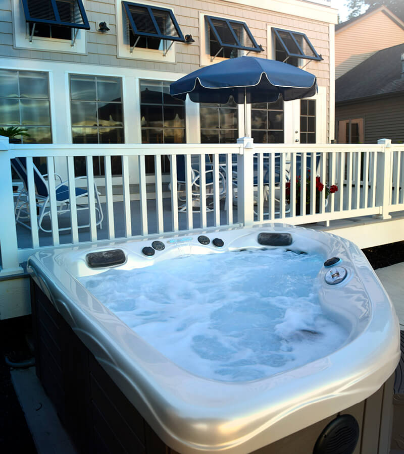 Hot Tub by Deck. A two-person hot tub is a cozy place to relax while spending time at vacation house.