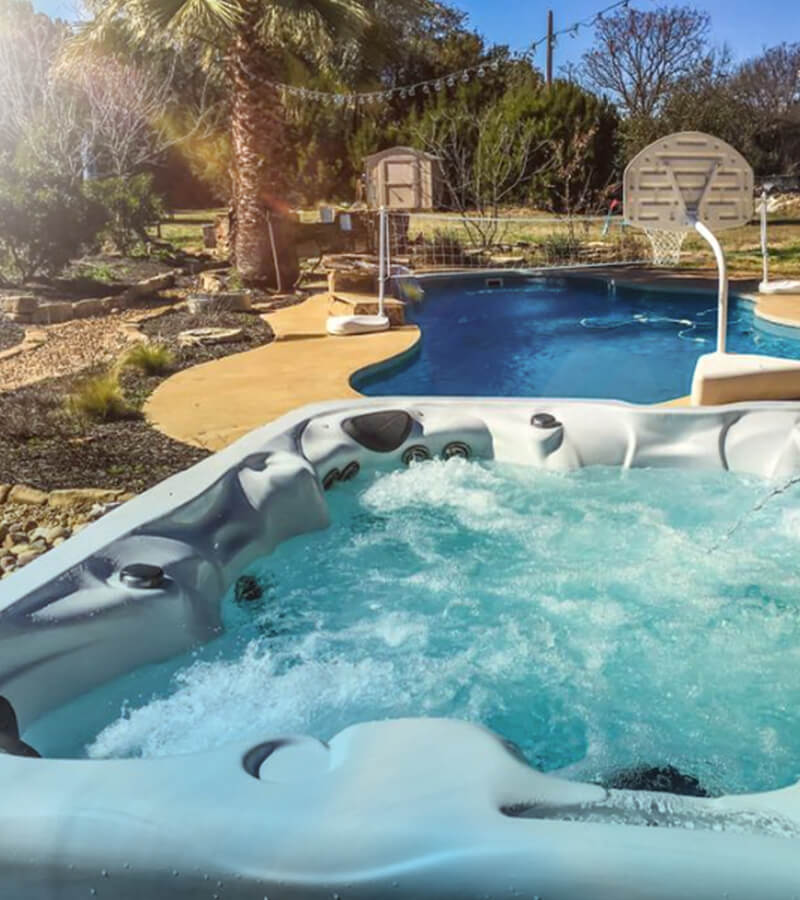 Make a Splash. In-ground pool and hot tub combo offers fun for everyone.