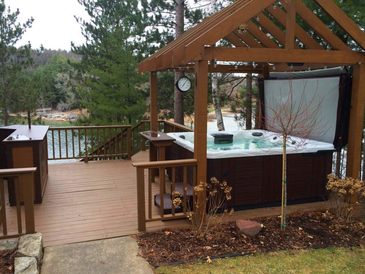Create your outdoor man cave complete with gazebo and bar close by