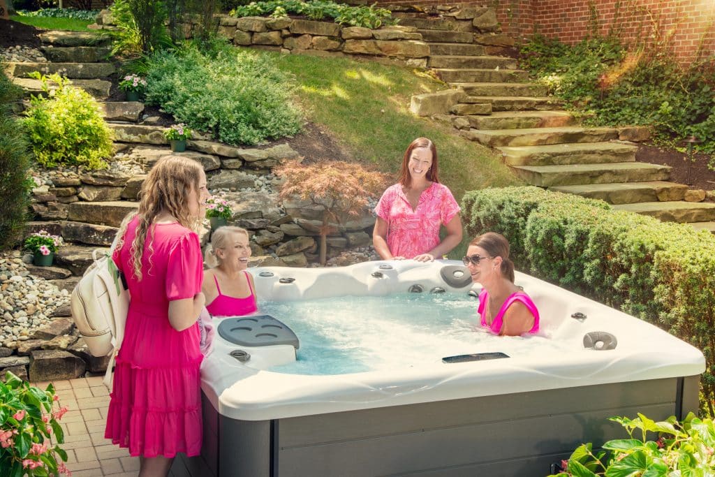 friends hang out by hot tub