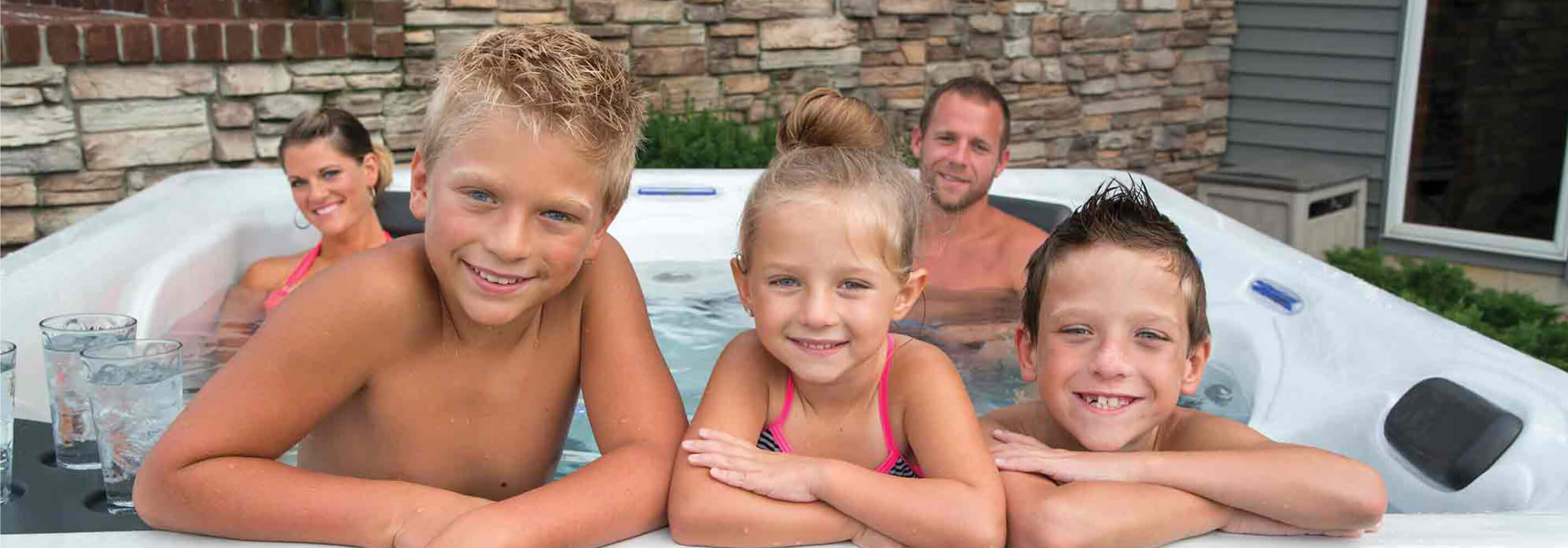 Family in a Master Spas hot tub