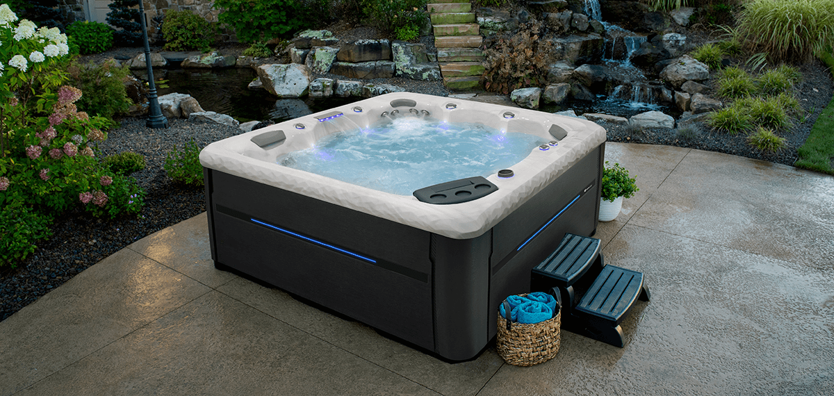 A MasterSpas Twilight hot tub in a backyard.