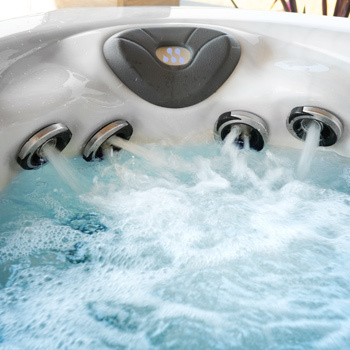 A woman sitting in the StressRelief Neck and Shoulder Seat