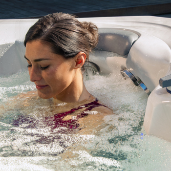 A woman sitting in the StressRelief Neck and Shoulder Seat