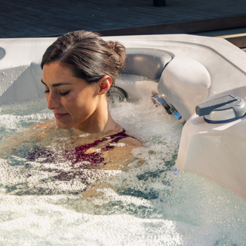 A woman sitting in the StressRelief Neck and Shoulder Seat