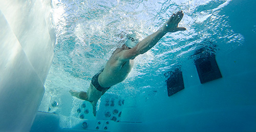 Ben Hoffman Swimming in a challenger series h2x swim spa by master spas