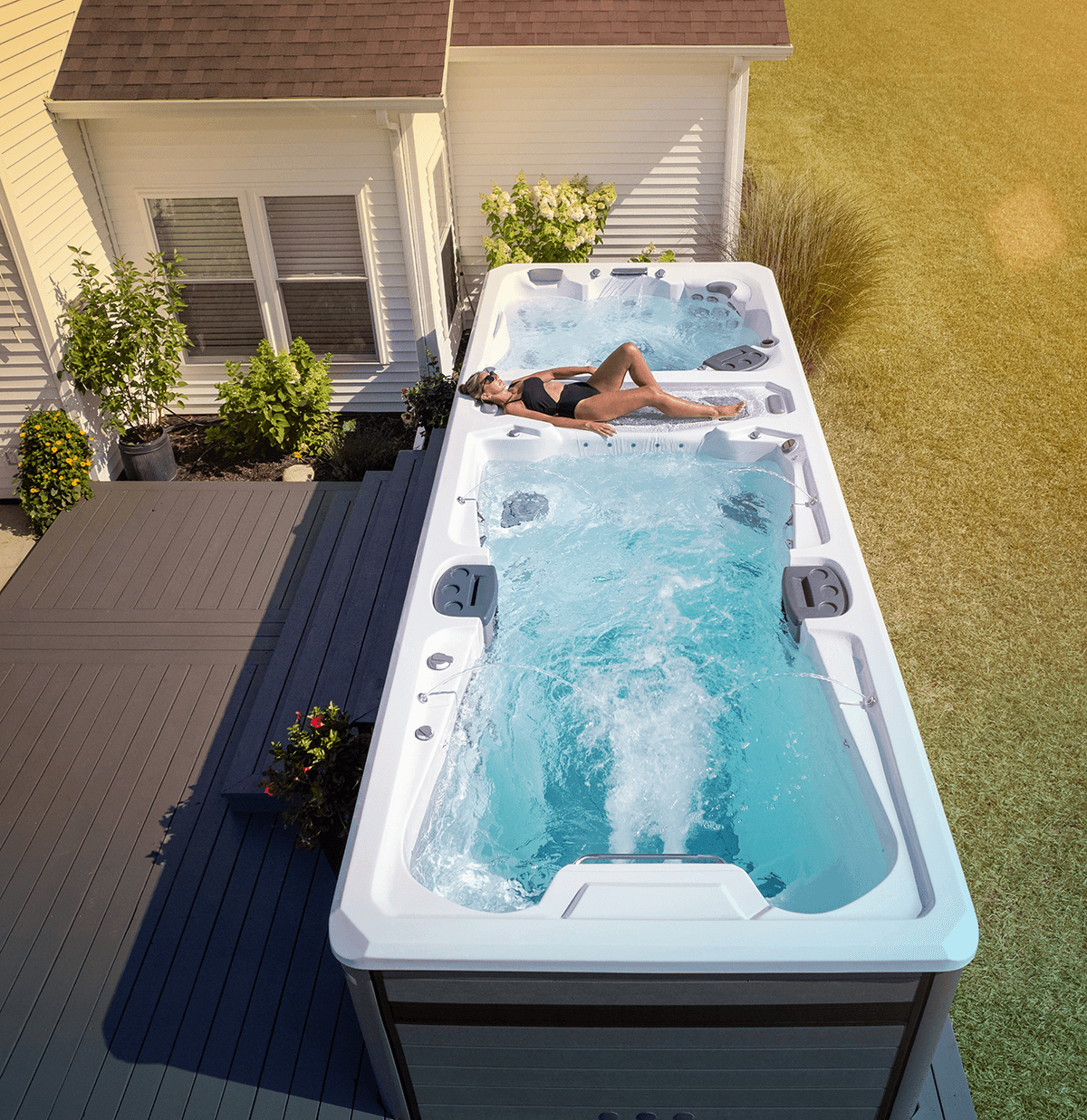 Woman lounging on the sundeck of a Trainer 21D.