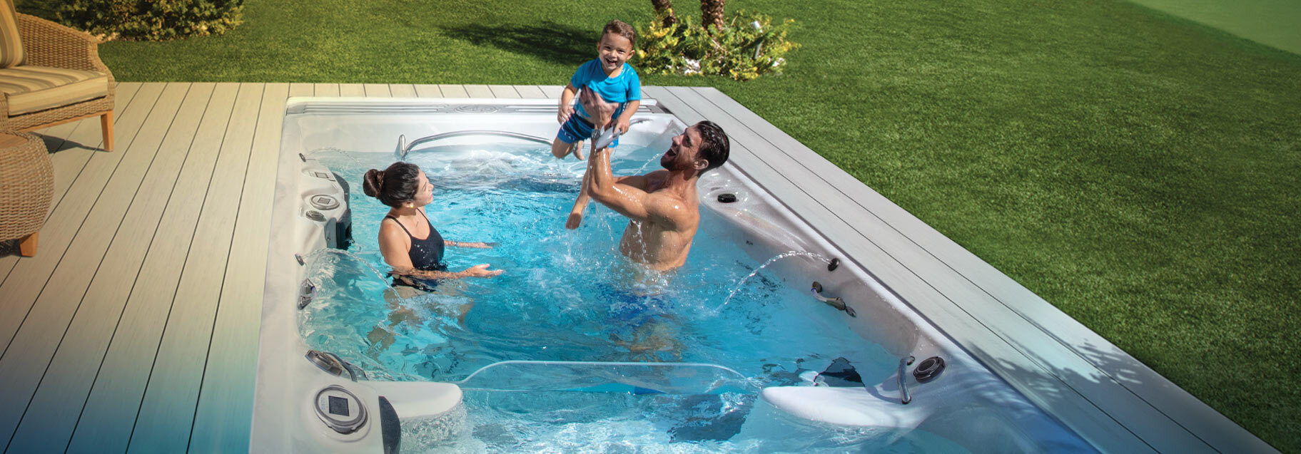 Michael Phelps with wife Nicole and son Boomer in a Swim Spa